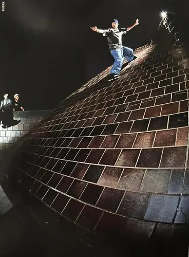 Ben Weis UFO Cess slide on brick wall.