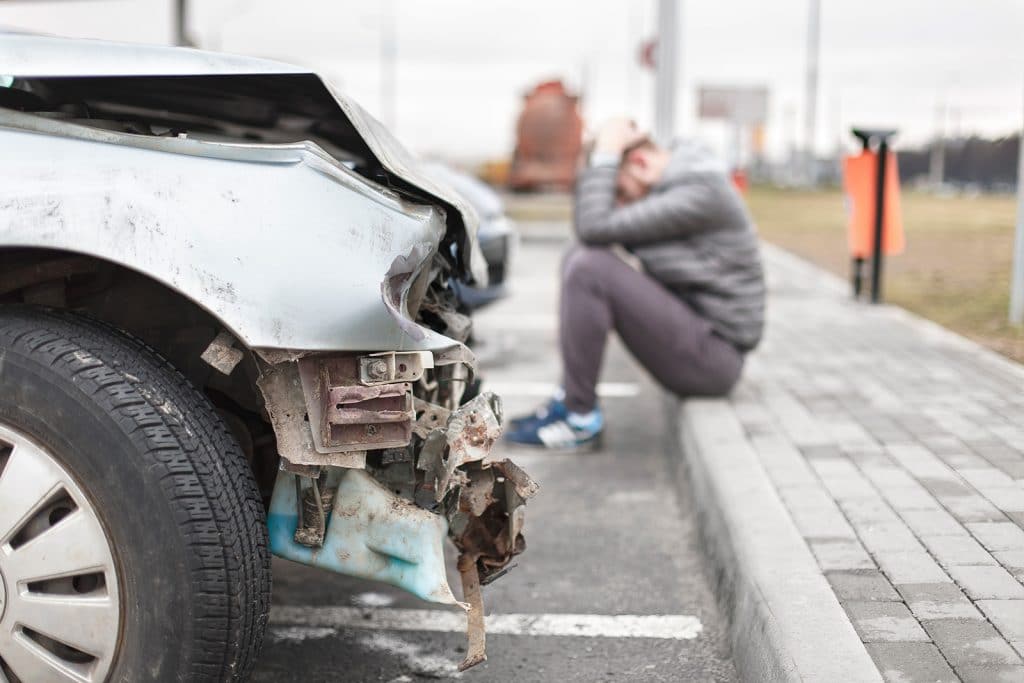 Documents and calculator illustrating Colorado damages calculation for a vehicle injury claim