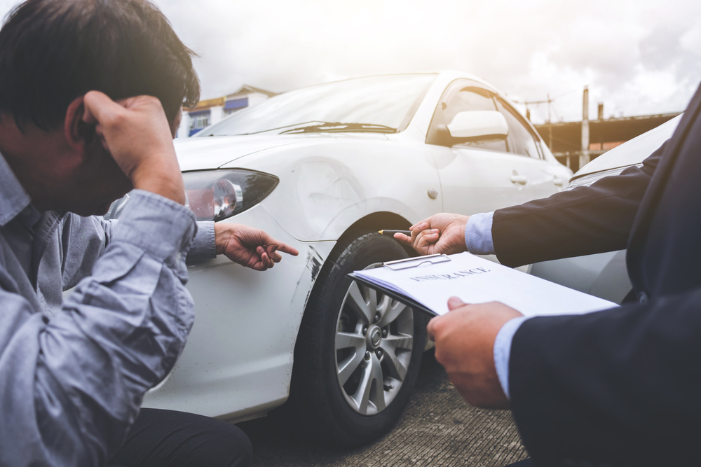 Attorney consulting with an injury client about a Denver vehicle collision claim