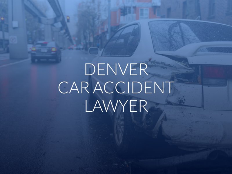 Insurance adjuster reviewing a vehicle collision claim file at a desk