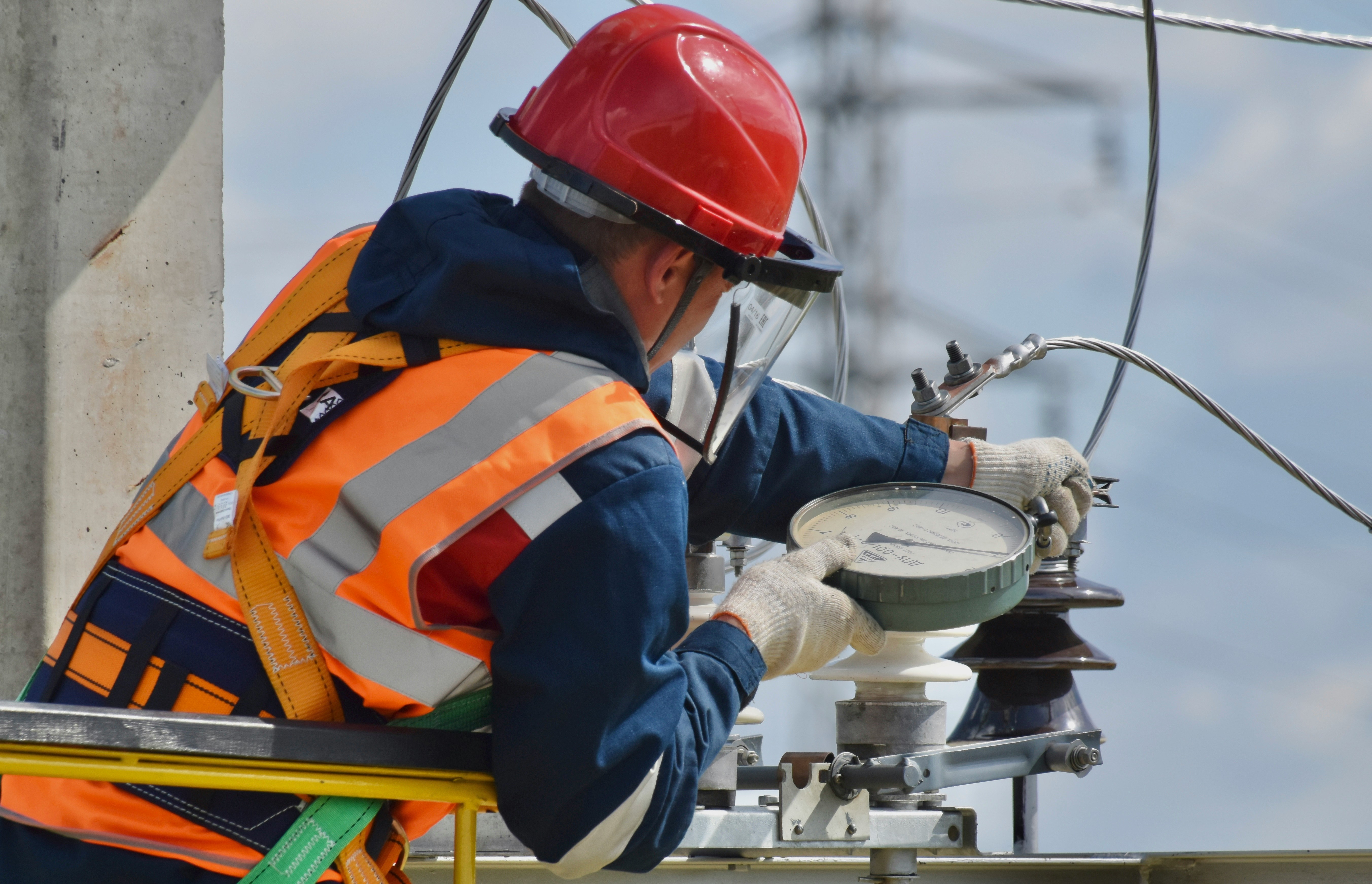 Electrician working on a wiring repair inside an open junction box